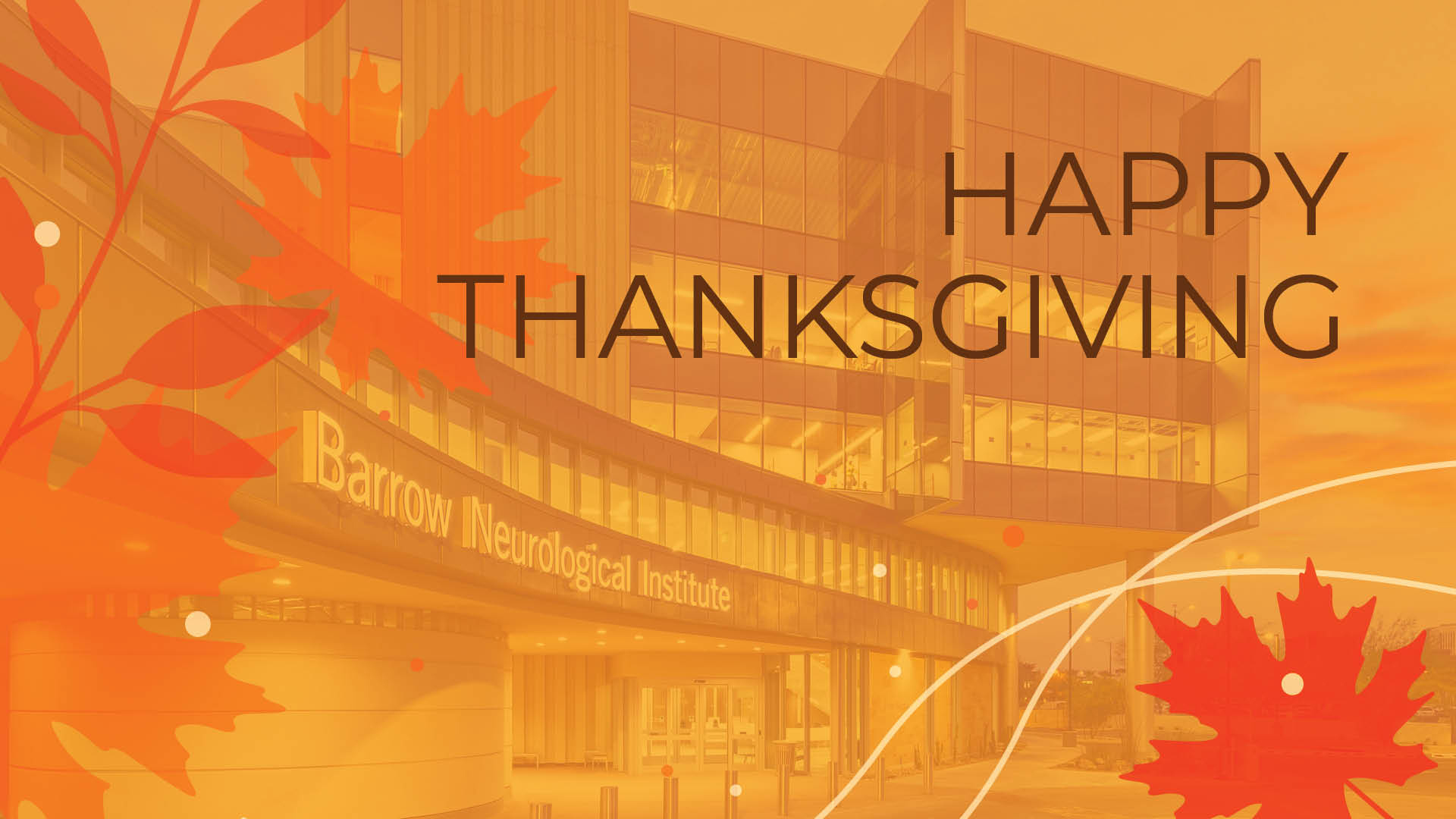 A photo of the exterior of Barrow Neurological Institute with a Thanksgiving overlay that says "Happy Thanksgiving"