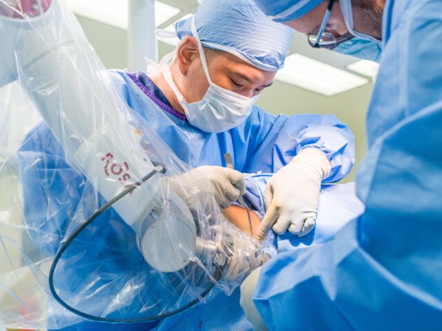 andrew yang uses the rosa robot to perform robotic epilepsy surgery