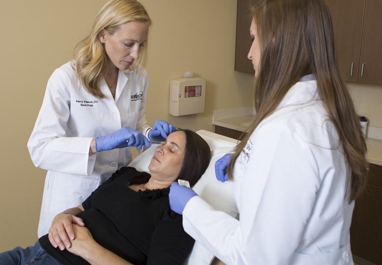 patient receiving botox injections for the treatment of chronic migraines at the jan and tom lewis migraine treatment program at barrow neurological institute in phoenix. Dr. kerry knievel is shown administering the shots.