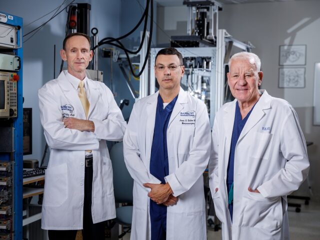 brian kelly, juan uribe, and volker sonntag stand in the sonntag spine center