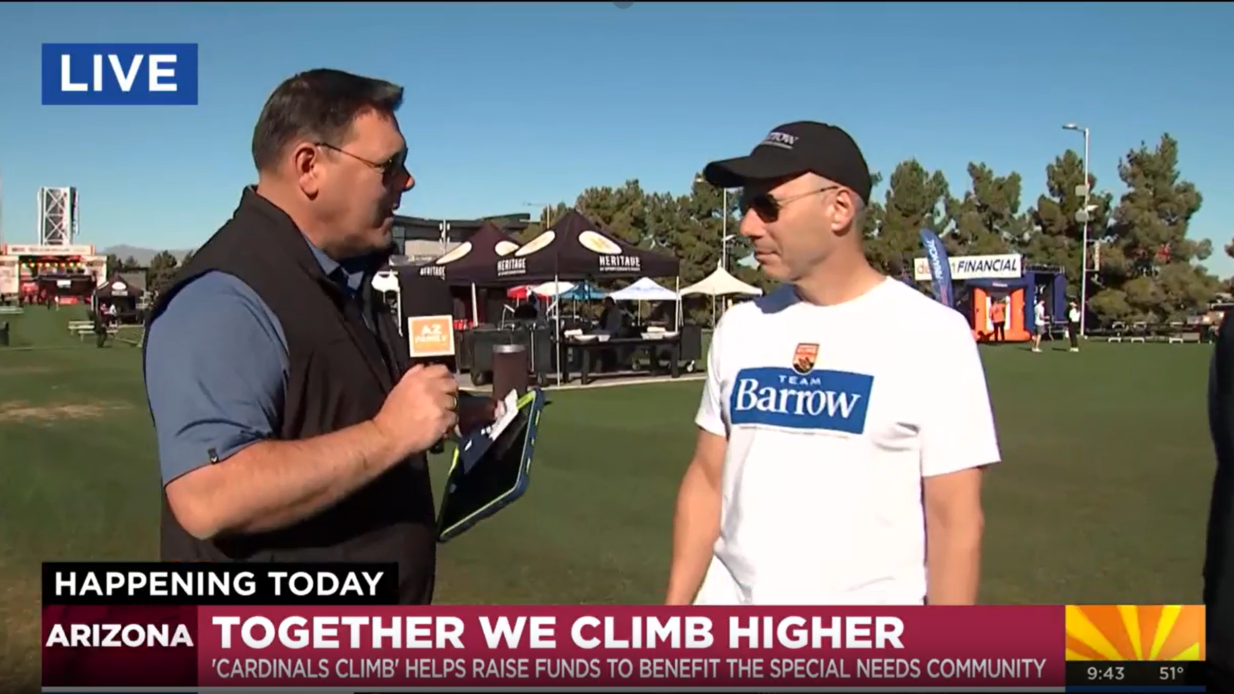 A meteorologist with a Phoenix-based TV station interviews Dr. Brad Racette at the 2026 Cardinals Climb