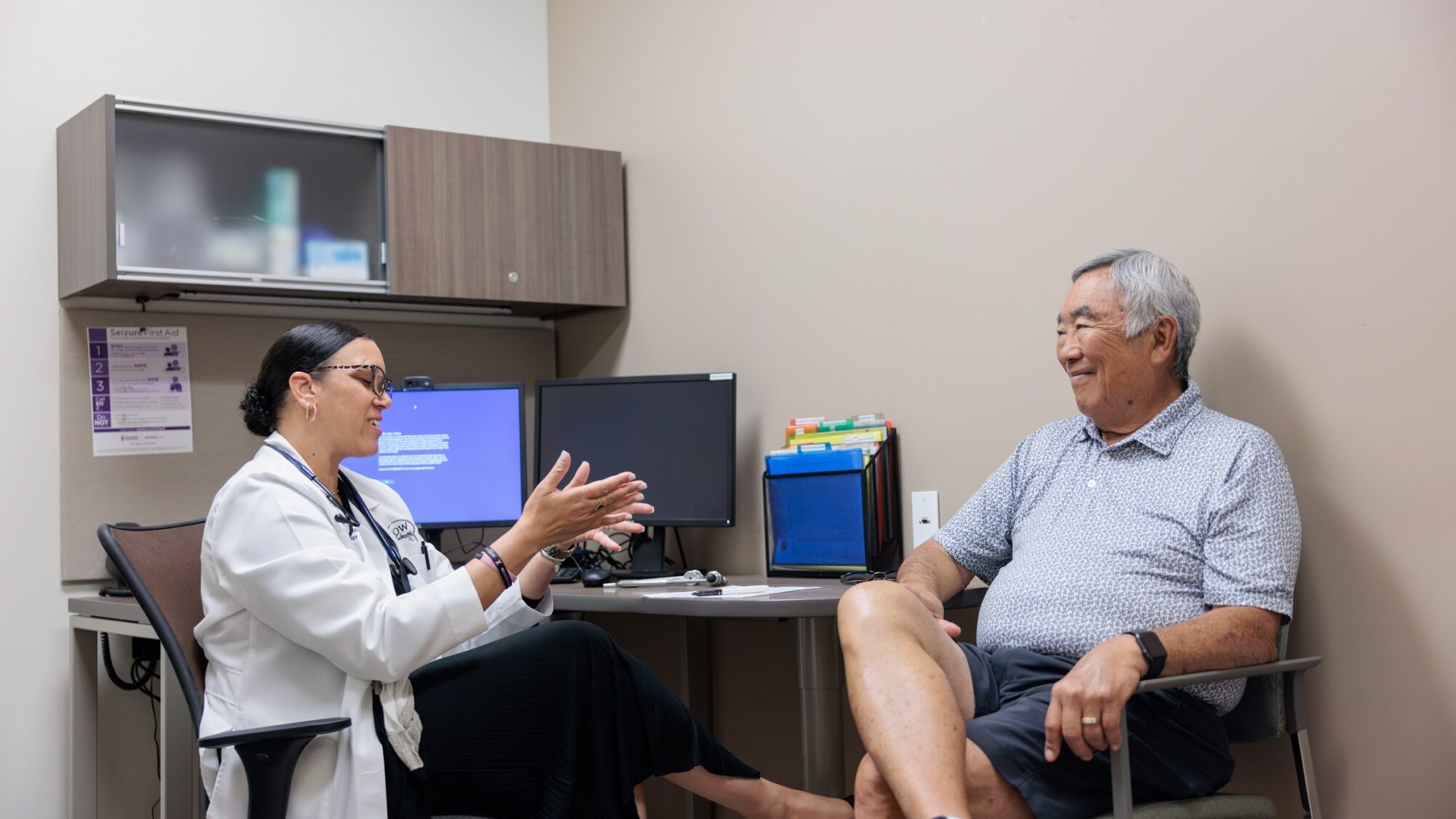 neurologist courtney schusse speaks to an epilepsy patient