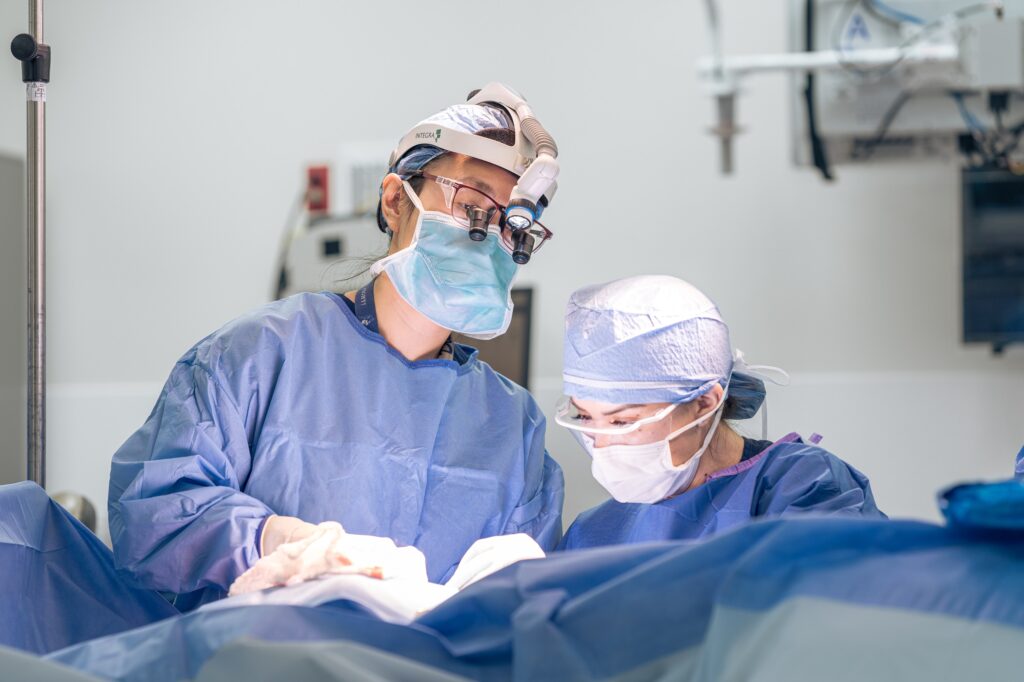 head and neck cancer surgeon deborah xie performs an operation