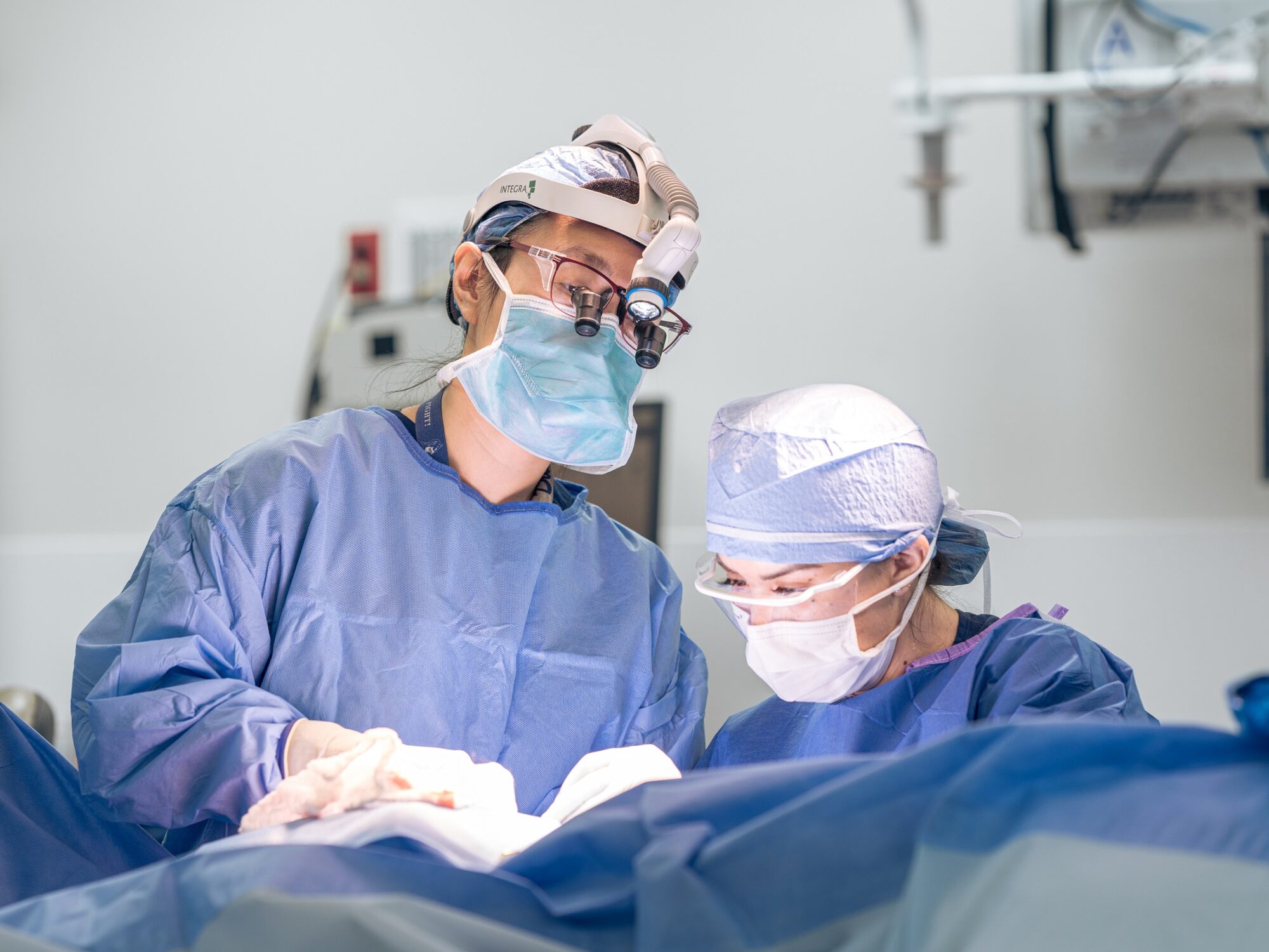 head and neck cancer surgeon deborah xie performs an operation