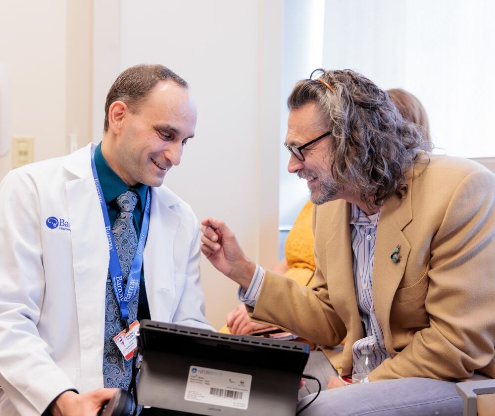 Epilepsy specialist Vladimir Shvarts interacts with a patient in the Barrow Epilepsy Center.