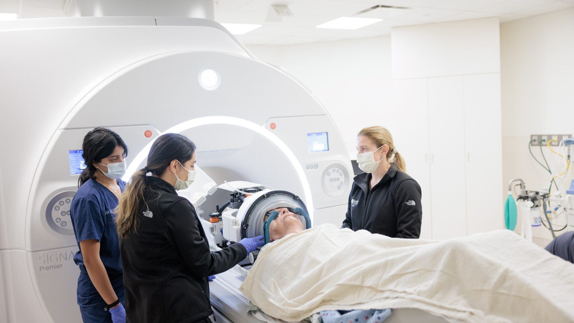 a patient with essential tremor is positioned in the MRI machine before undergoing focused ultrasound thalmotomy