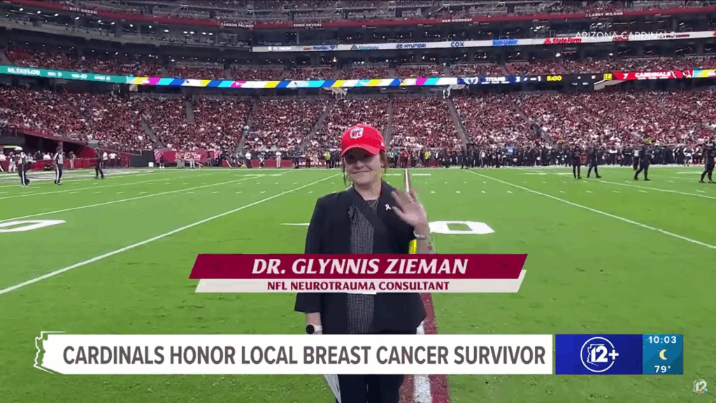 Photo of Dr. Glynnis Zieman on the field at State Farm Stadium, where she was honored as part of NFL's Crucial Catch.