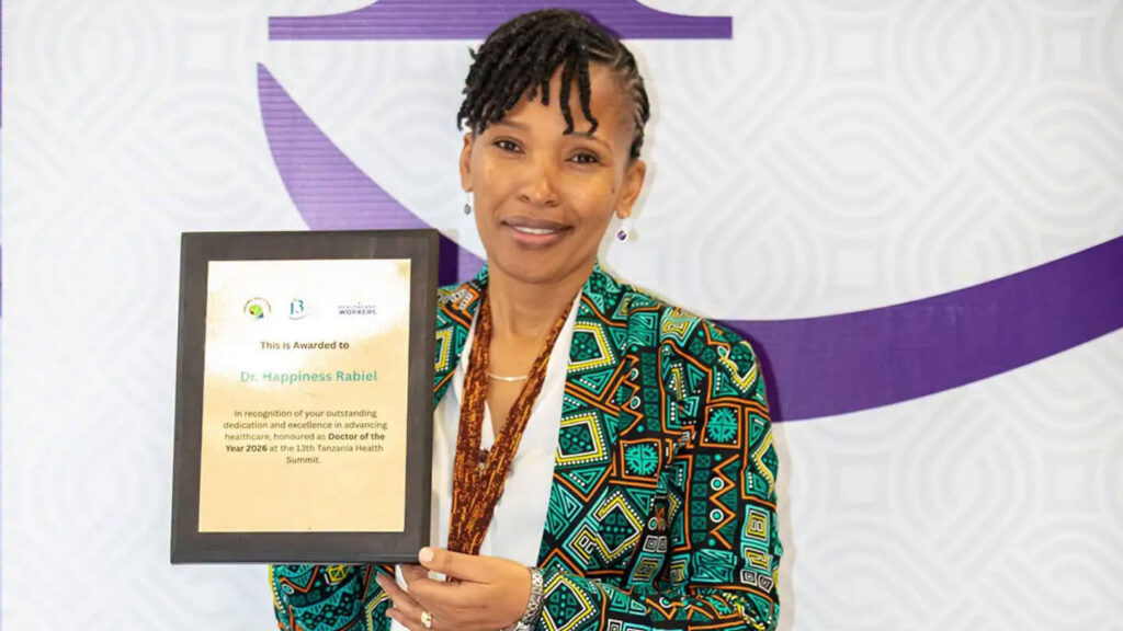 Dr. Happiness Rabiel with her "Doctor of the Year" plaque at the 13th Tanzanian Health Summit