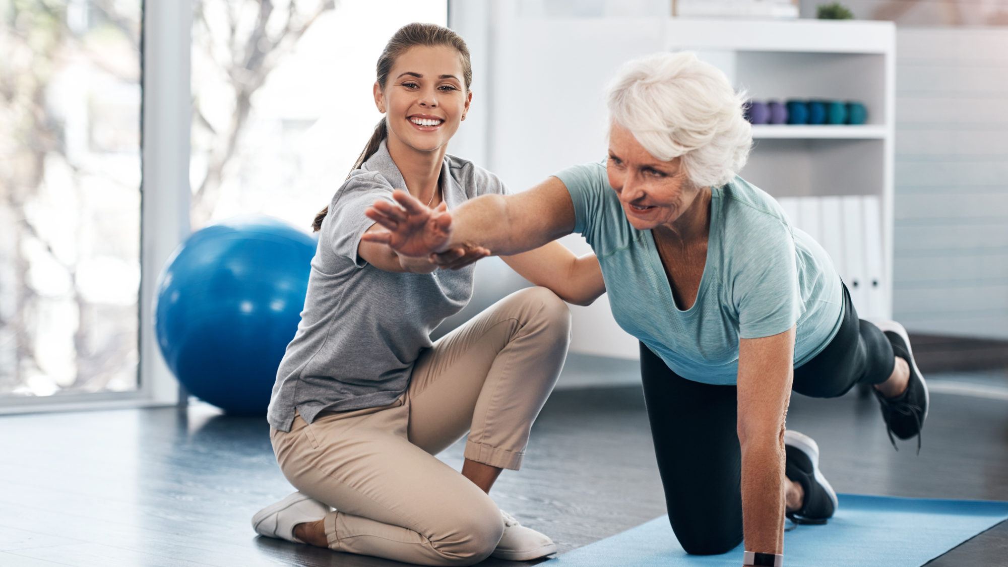 senior woman being treated by a physiotherapist