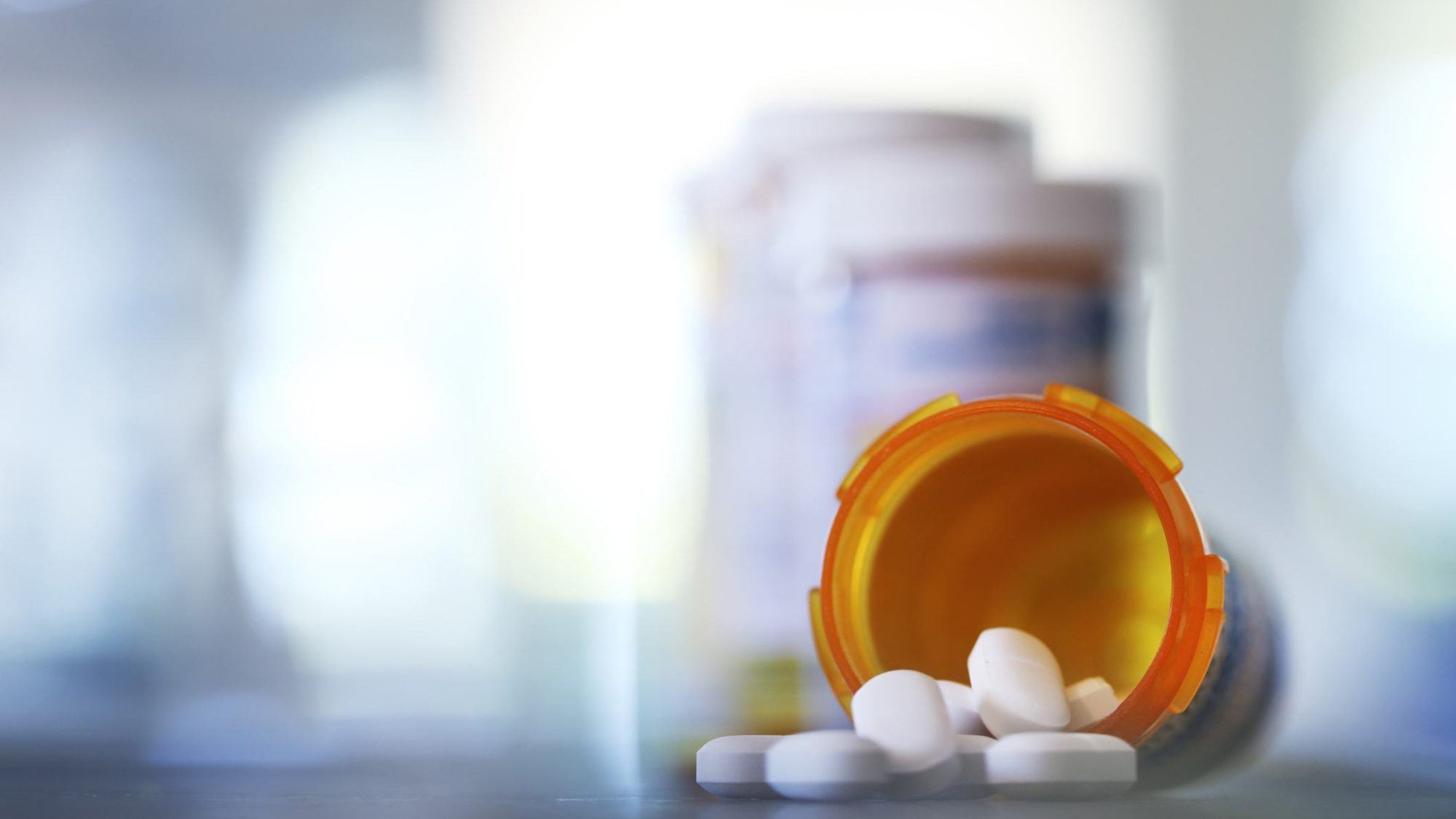 pills pouring out of prescription bottle