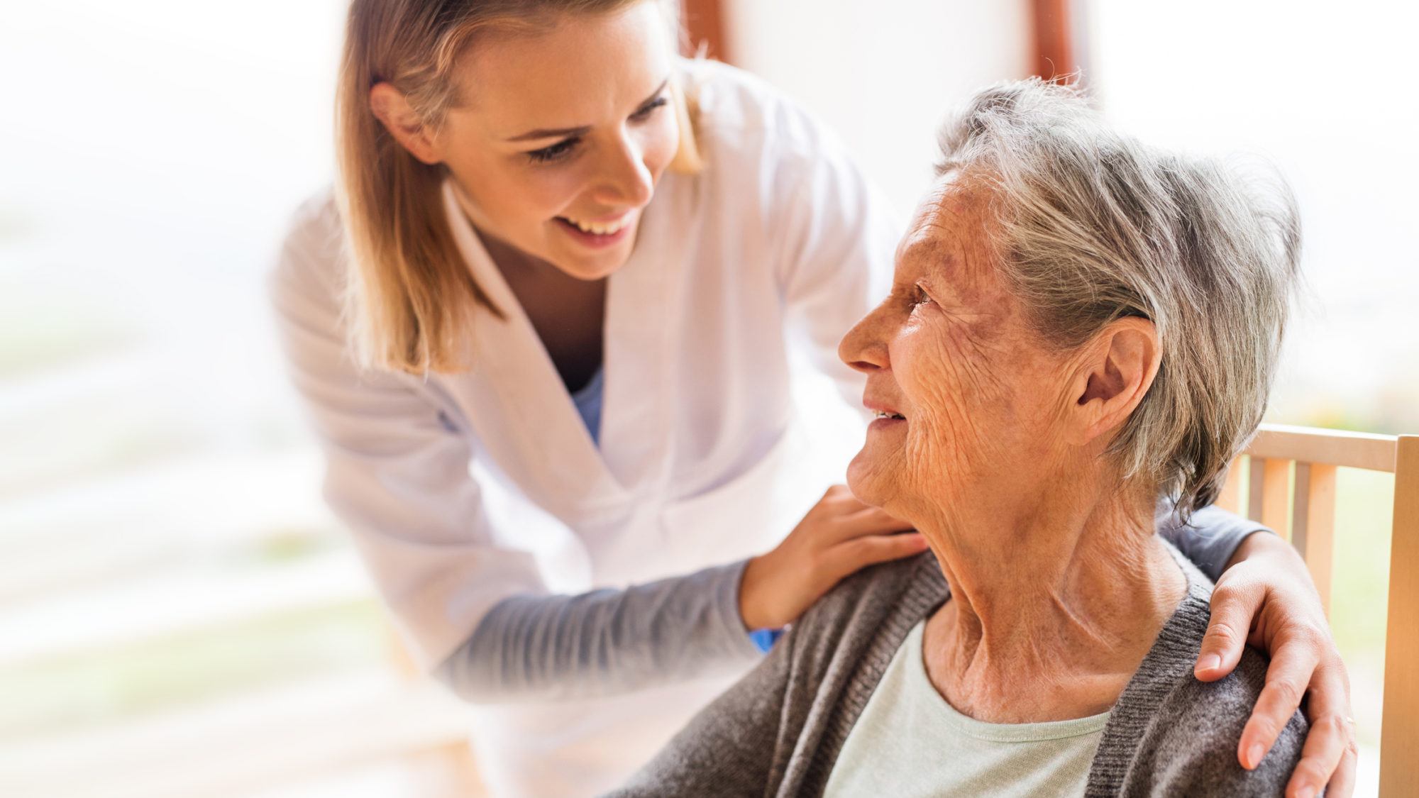 nurse caring for senior patient