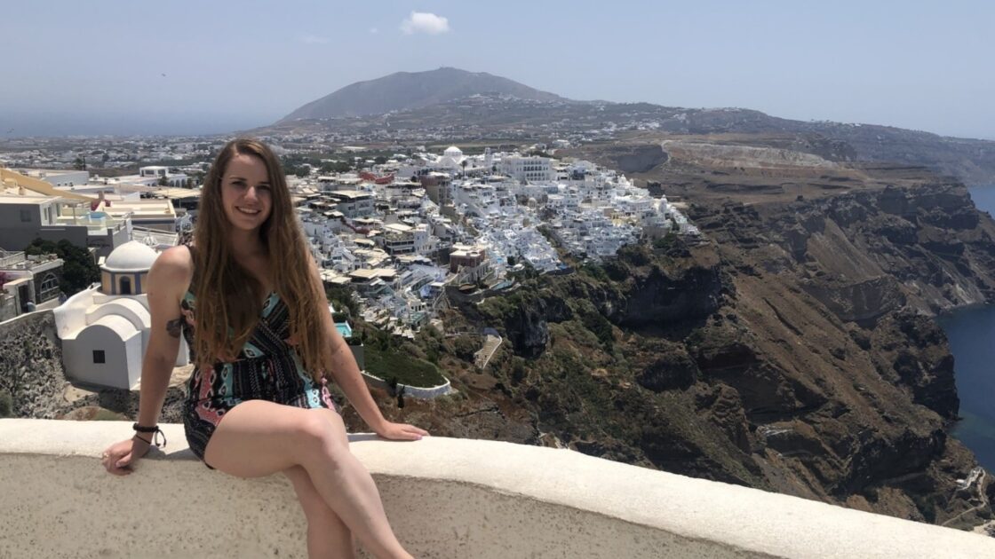 kelsey beck on a balcony overlooking a landscape