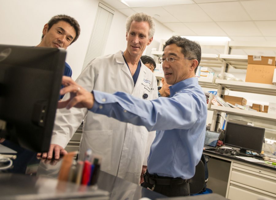 A photo of Dr. Michael Lawton and Dr. Tomoki Hashimoto in a laboratory
