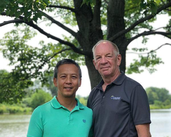 Mark Barrett, an endovascular surgery patient standing with his husband