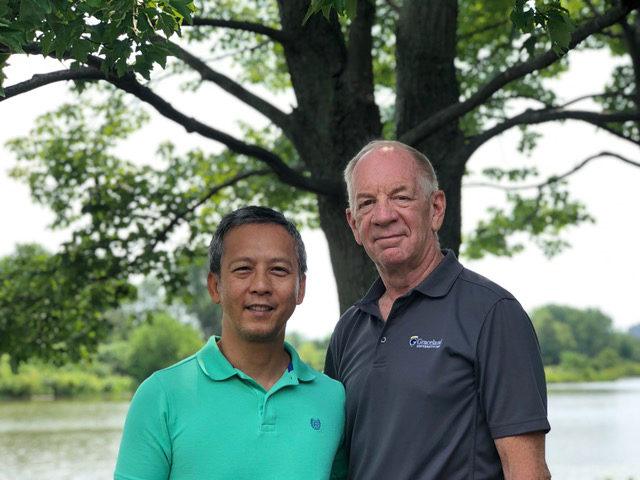 Mark Barrett, an endovascular surgery patient standing with his husband