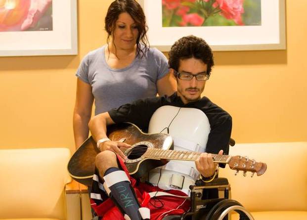 Patient playing guitar