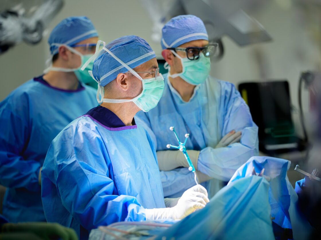 nader sanai uses neuronavigation to remove a brain tumor in an operating room.
