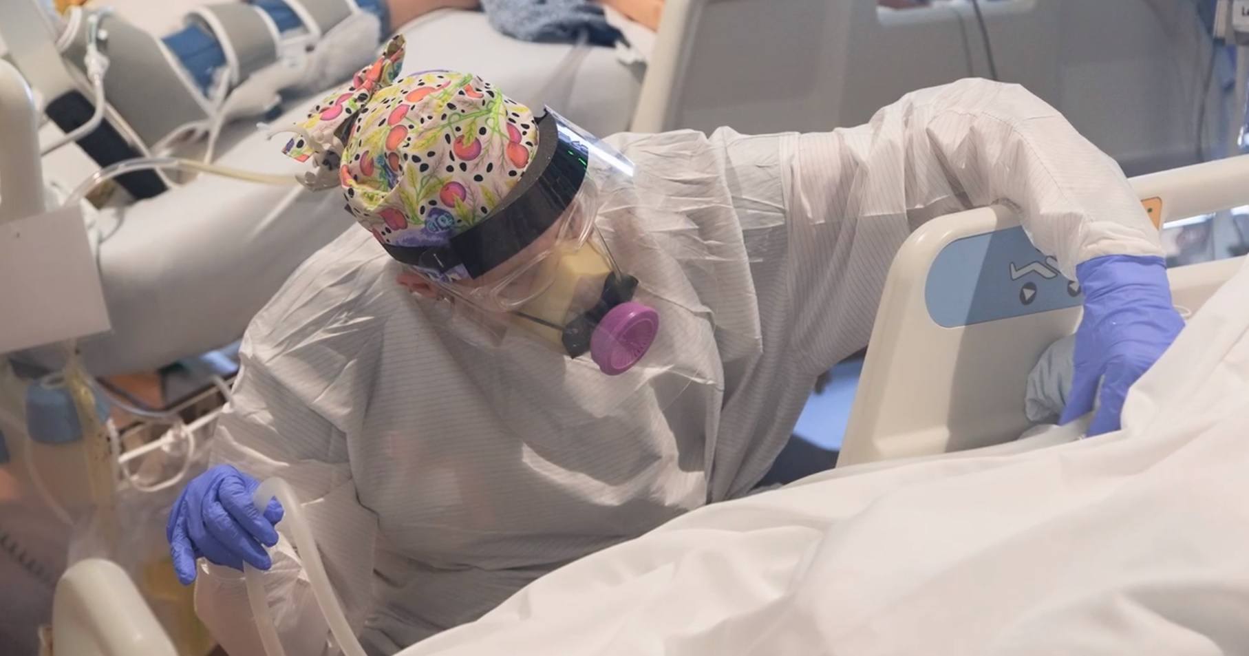 a barrow neuroscience nurse treats a patient with covid-19