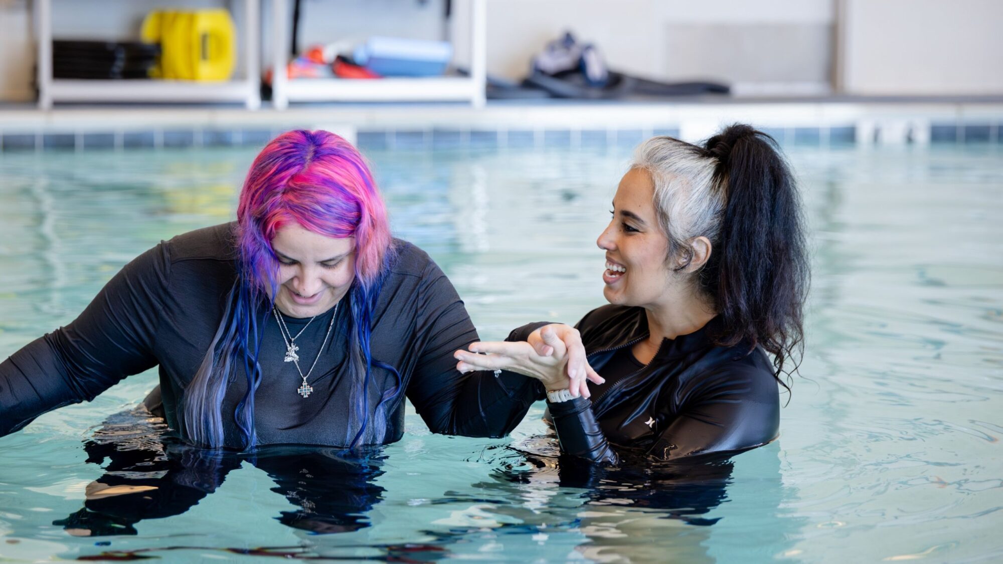 Barrow Neuro-Rehab Patient completes exercises in a pool with their therapist.
