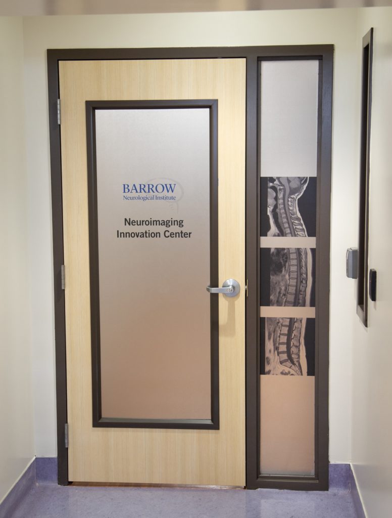 A door to the Barrow Neuroimaging Innovation Center shows imaging of the spine