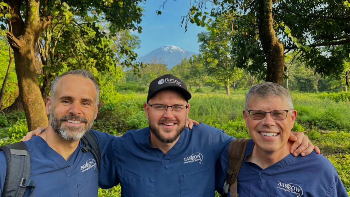 Photo of a neuroradiology team from Barrow at the base of Mount Kilimanjaro