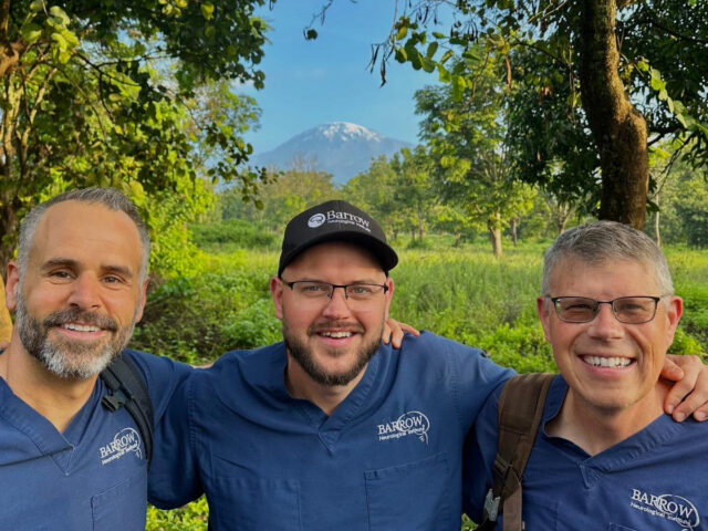 Photo of a neuroradiology team from Barrow at the base of Mount Kilimanjaro