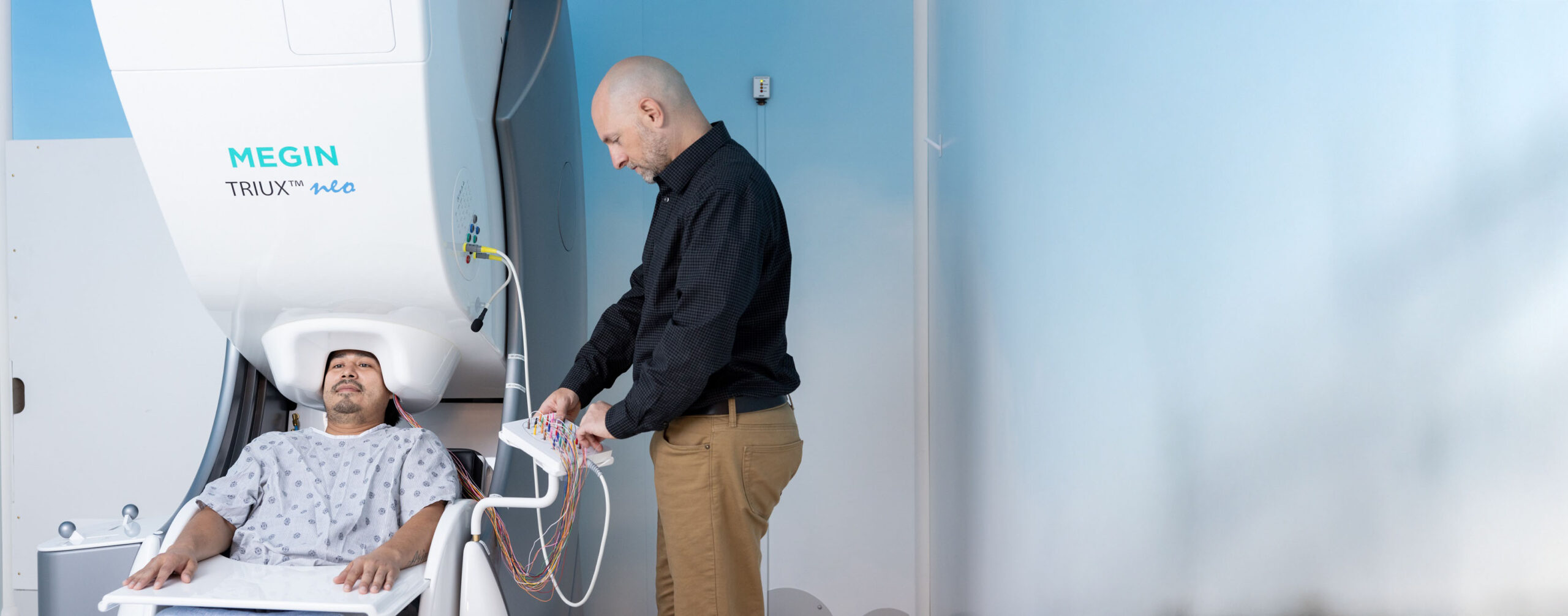 a patient undergoes magnetoencephalography, or M-E-G