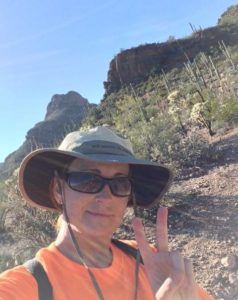 photo of rebecca lester hiking in the desert