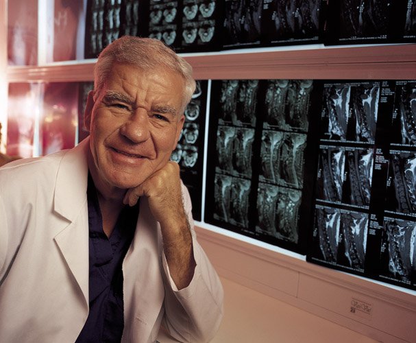 Volker Sonntag, MD, poses in front of imaging