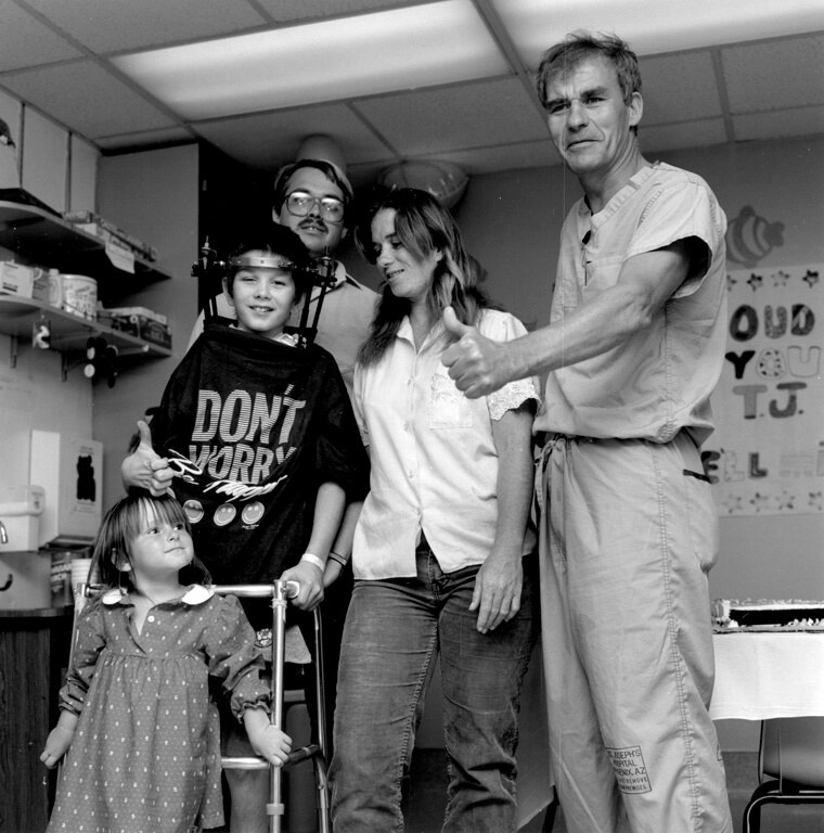 Dr. Volker Sonntag with patient Timothy Mathias and family