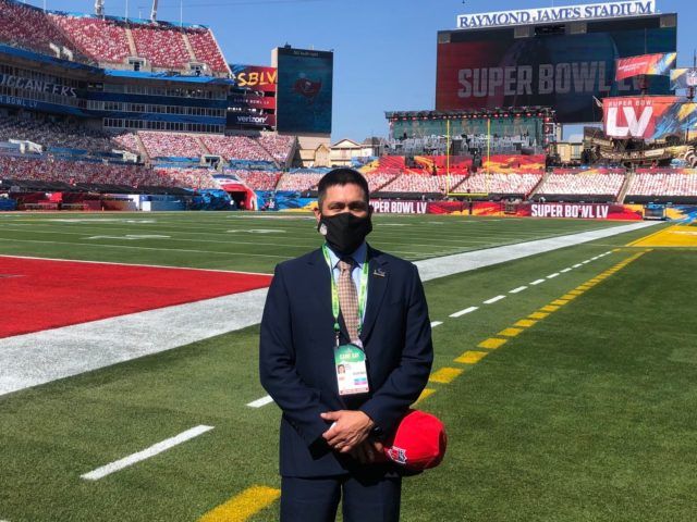 Javier Cardenas on the field at Super Bowl 55