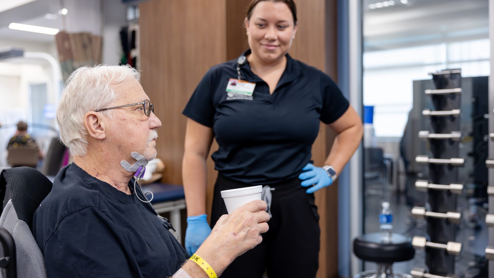 Barrow Neuro-Rehab patient receiving therapy with synchrony dysphagia solutions to help him swallow and speak.